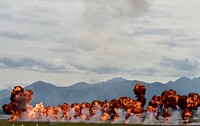 A pyrotechnics display explodes during the Arctic Thunder Open House at Joint Base Elmendorf-Richardson, Alaska, Sunday, July 31, 2016. The biennial event is historically the largest multi-day event in the state and one of the premier aerial demonstrations in the world. Opened to the public, Arctic Thunder featured more than 40 key performers and ground acts July 30 and 31. (U.S. Air Force photo/Justin Connaher). Original public domain image from Flickr
