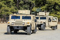 Soldiers from the New Jersey Army National Guards 2-102nd Cavalry prepare two HMMWV's to have a TOW system mounted for live fire training at Joint Base McGuire-Dix-Lakehurst, N.J., March 23, 2017. The TOW (Tube-launched, Optically tracked, Wire-guided) is an American anti-tank missile. (U.S. Army photo by Staff Sgt. Nicholas Young/Released). Original public domain image from Flickr