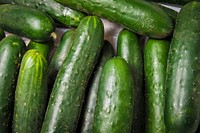 Vender cucumbers at the U.S. Department of Agriculture (USDA) farmers market at the USDA headquarters in Washington, D.C., June 2, 2017. USDA photo by Preston Keres. Original public domain image from Flickr
