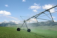 Pivots with sprinklers, mountains in the background. June 1989. Original public domain image from Flickr