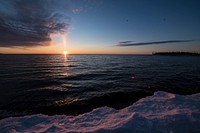 Sunrise over Lake Superior at Grand Marais, MN is one of many cities that visitors stay when enjoying winter recreation activities and scenic views of the U.S. Department of Agriculture (USDA) Forest Service (FS) Superior National Forest region in Minnesota, on Feb 28, 2018.