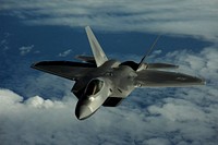 A U.S. Air Force F-22 Raptor aircraft assigned to the 90th Fighter Squadron out of Elmendorf Air Force Base, Alaska, flies near Guam Feb. 17, 2010. (DoD photo by Staff Sgt. Andy M. Kin, U.S. Air Force/Released). Original public domain image from Flickr