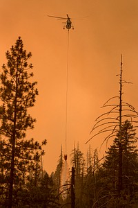 Spot fires develop and are dealt with by digging line around and dropping water from helicopters. Taylor Creek and Klondike Fires, Rogue-Siskiyou NF, Oregon, 2018. (Forest Service photo by Kari Greer). Original public domain image from <a href="https://www.flickr.com/photos/usforestservice/43146108755/" target="_blank" rel="noopener noreferrer nofollow">Flickr</a>