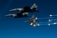 A U.S. Air Force F-15E Strike Eagle aircraft with the 335th Fighter Squadron releases flares during a local training mission over Seymour Johnson Air Force Base, N.C., Dec. 17, 2010.