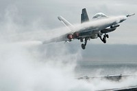 A U.S. Navy F/A-18F Super Hornet aircraft, with Strike Fighter Squadron 22 (VF-22), launches from the flight deck of the aircraft carrier USS Carl Vinson (CVN 70) Dec. 17, 2010, while underway in the Pacific Ocean.