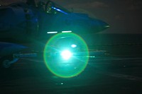 An AV-8B Harrier jump jet returns to USS Kearsarge for fuel and ammunition resupply