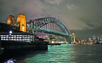 Sydney Harbour Bridge.The Sydney Harbour Bridge is a heritage-listed steel through arch bridge across Sydney Harbour that carries rail, vehicular, bicycle, and pedestrian traffic between the Sydney central business district and the North Shore. Original public domain image from Flickr