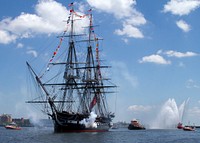 The USS Constitution fires a 21-gun salute in honor of America's 237th birthday during the ship's annual Fourth of July turnaround cruise in Boston Harbor on July 4, 2013.