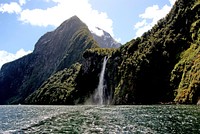 Waterfall from Milford Sound.NZ. Stirling Falls is one of permanent waterfalls on the Milford Sound. This one drops 155m below a hanging valley between mountains The Elephant and The Lion. Fiordland National Park. Original public domain image from Flickr