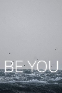 White neon text BE YOU typography