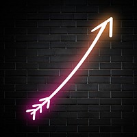 Neon pink curved arrow sign on brick wall