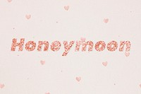 Glittery honeymoon typography on heart patterned background