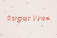Glittery sugar free typography on heart patterned background
