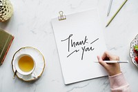 Woman writing a thank you note