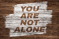 You are not alone text wood texture brush stroke effect typography