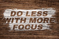 Do less with more focus printed word coarse wood texture
