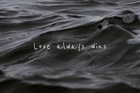 Love always wins quote on a water wave background