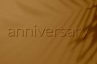 Anniversary word embossed concrete texture shadow plant