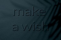Textured blue concrete embossed make a wish message typography