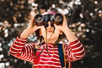 Adventure desktop wallpaper background, little girl using binoculars, warm tone