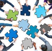 Group of People Holding Jigsaw Puzzle in Photo and Illustration