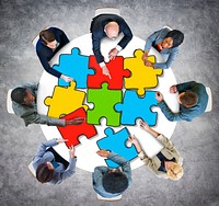 Group of Business People with Jigsaw Puzzle in Photo and Illustration