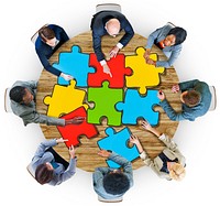 Group of Business People with Jigsaw Puzzle in Photo and Illustration