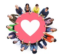 Multiethnic People Holding Hands with Heart Symbol