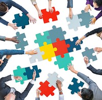 Aerial View of Business People Piecing Puzzle Pieces