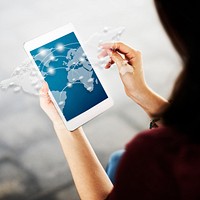 Woman working on digital device network graphic overlay