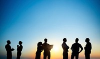 Group Of Business People Silhouettes Working Outdoors And A Copy Space Above