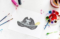 Child with a drawing of pirate hat