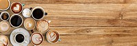 Coffee cups on a brown wooden panel  