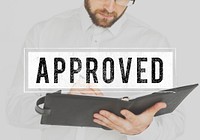 Businessman working and writing with approved word