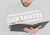 Businessman working and writing with guarantee stamp