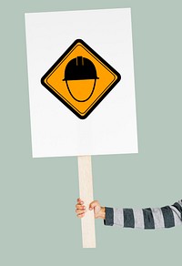 Studio Shoot Holding Banner with Safety Helmet Attention Sign