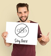 Smiling man holding soy-free sign.