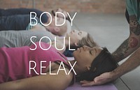 Group of people training in yoga class for body soul and mind relief
