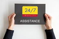 Hands holding a banner with 24/7 service