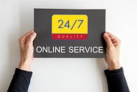 Hands holding a banner with 24/7 service