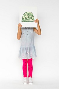 Child with a drawing of soldier helmet