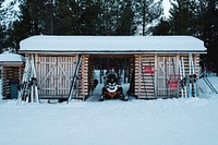 Parked motor sled in a log cabin