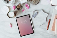 Aerial view of digital tablet on table workplace