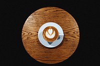 Latte art on wooden table vector