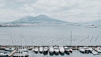 Boats docked at a pier in Naples, Italy