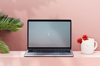 Laptop mockup, pink wall workspace psd