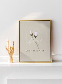 Golden frame against a white wall