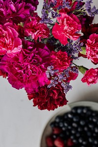 Fresh berries and flowers on the table