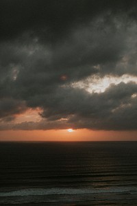 Orange sky over the gloomy beach