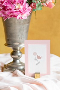 Flower vase by a card
